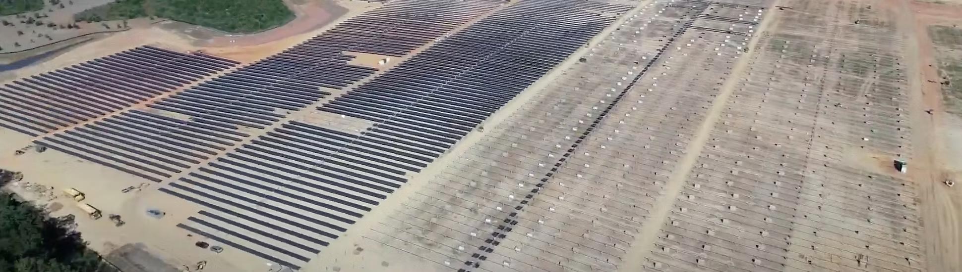 Industrial-scale solar facility covering natural landscape